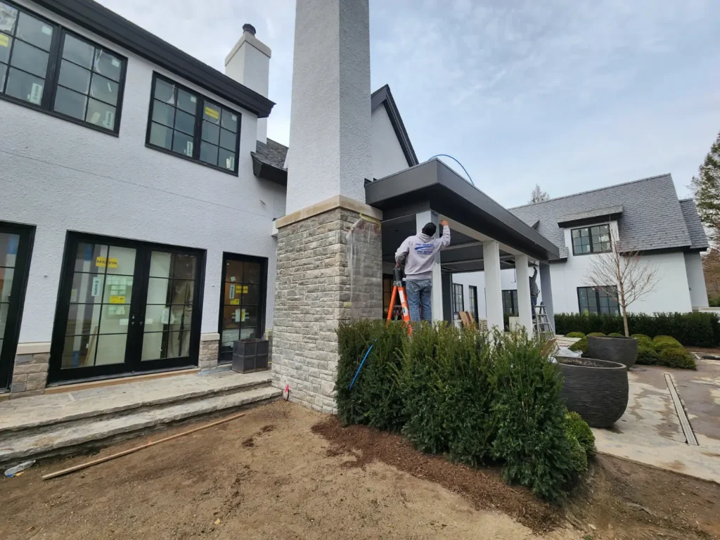 Pro Painters Service Area painting and finishing an exterior house in Bloomfield Township Metro Detroit