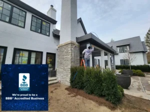 Pro Painters LTD contractors painting the exterior of a Metro Detroit home, with BBB Accredited Business graphic displayed in the lower left corner.